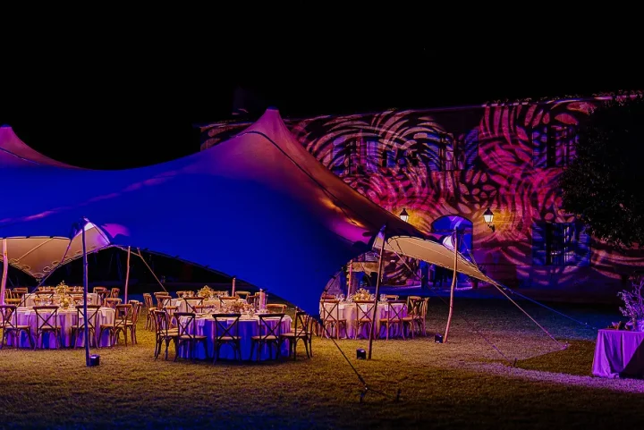 Destination management company in the Balearic Islands delivering bespoke event setups with stretch tents, creative lighting, and elegant dining experiences